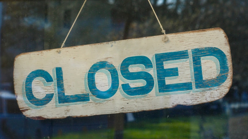 Photo of a business closed sign