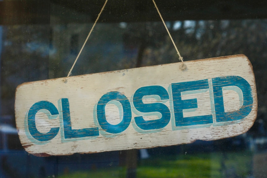 Photo of a business closed sign