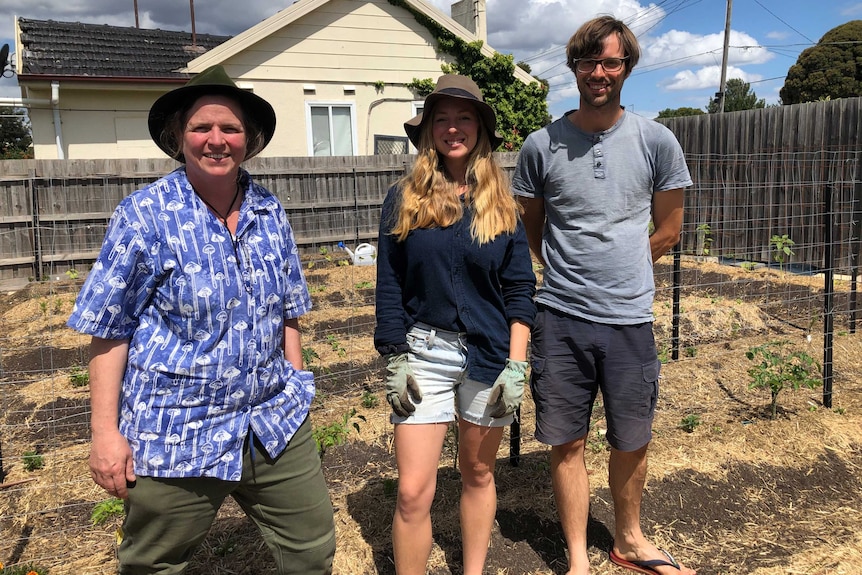 McMullan-Fisher, Payne and Clipp in the backyard.