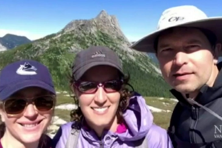 Sophie Dowsley, 34, of Melbourne with partner Gregory Tiffin, 44, and an unidentified woman.