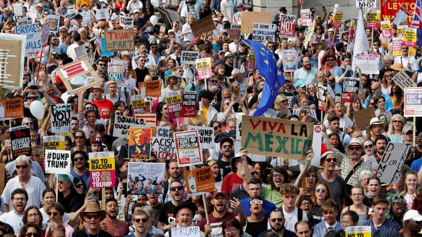 Demonstrators protest against the visit of US President Donald Trump.