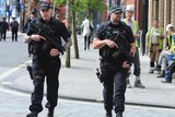Armed police patrol the streets near to Manchester Arena in central Manchester