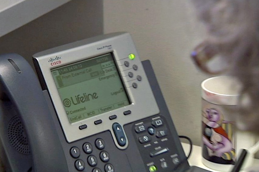 A phone rings at a Lifeline call centre.