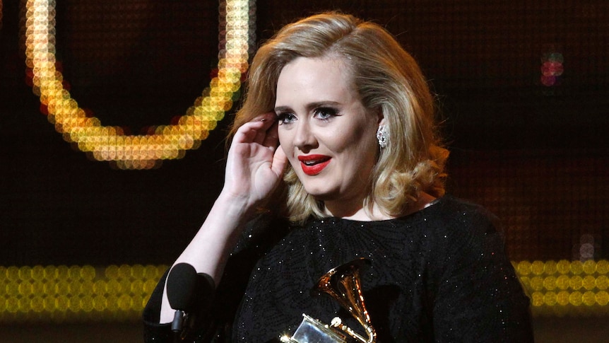 Adele accepts the Grammy award for Best Pop Solo Performance
