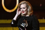 Adele accepts the Grammy award for Best Pop Solo Performance