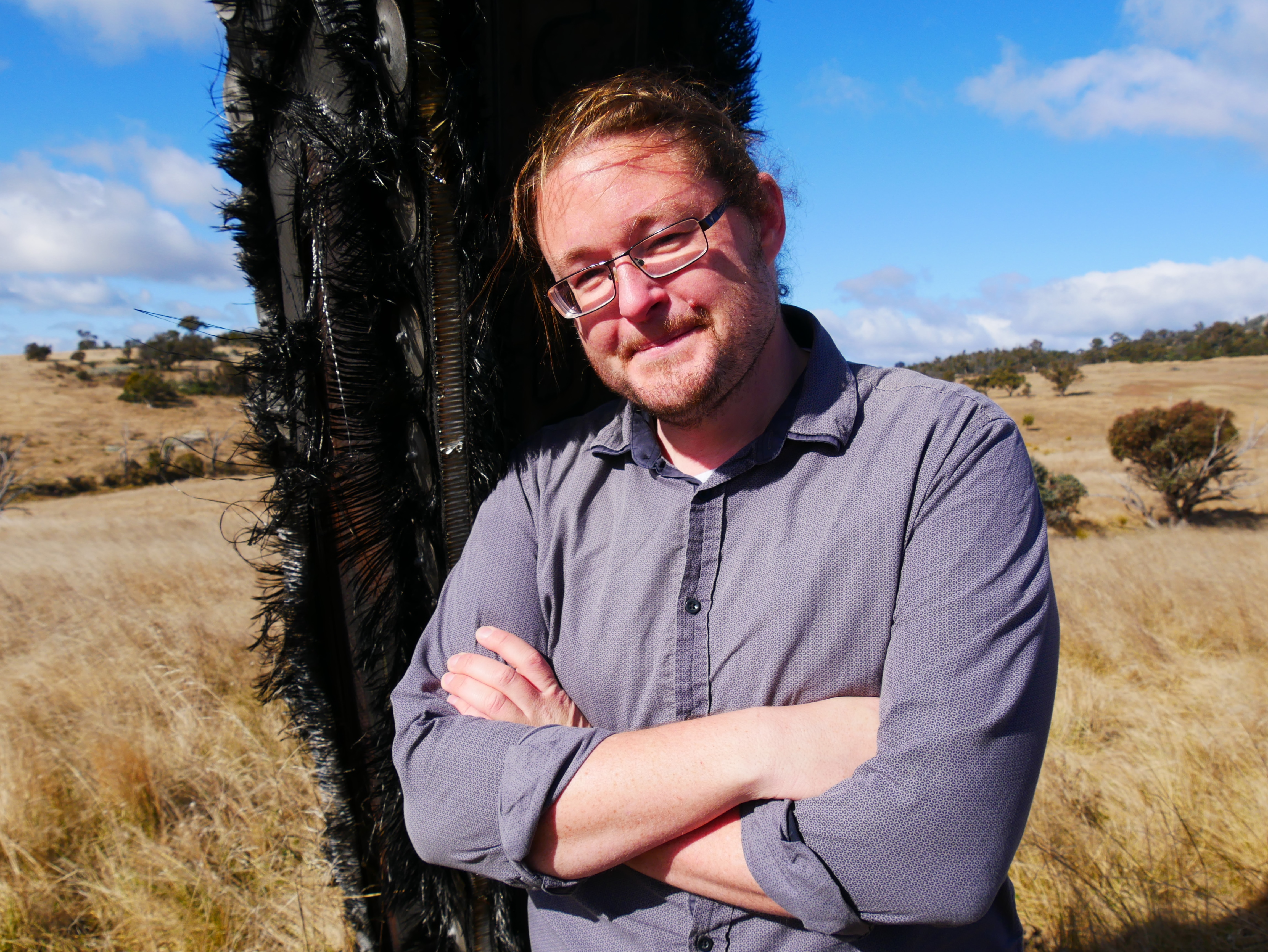a man leaning against space junk