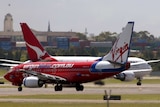Qantas and Virgin planes on tarmac