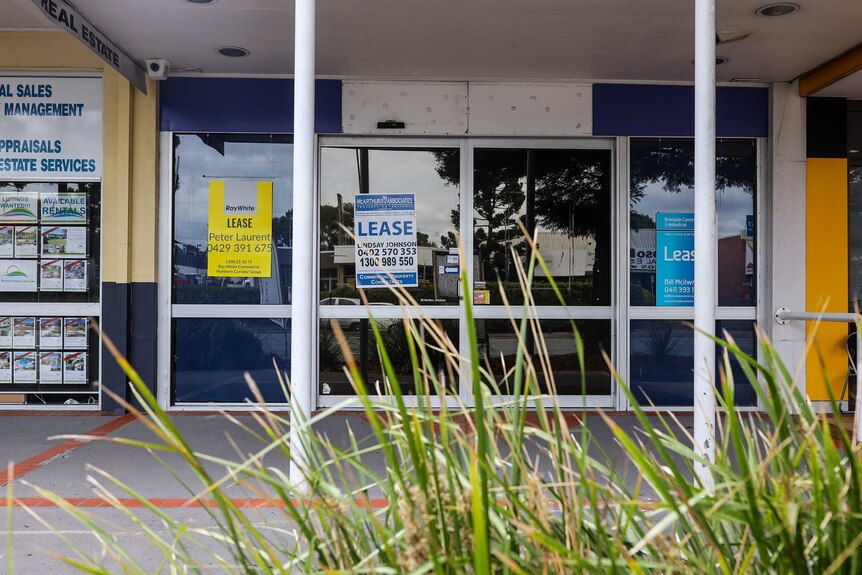 An empty shop on Gympie Road at Strathpine with 'Lease' signs in the window in April 2019