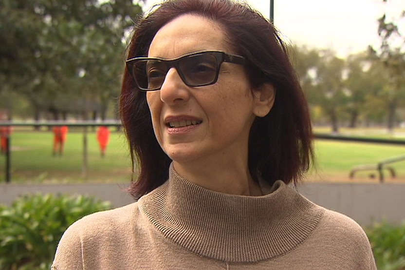 Freedy Coory wearing sunglasses standing near Fawkner Park.