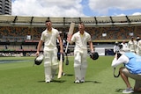 Australia's David Warner (R) and Cameron Bancroft walk off the Gabba after the first Ashes Test.