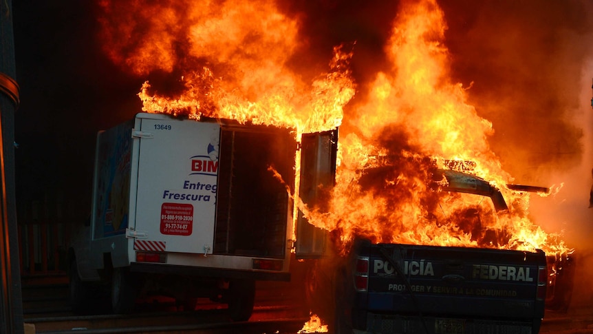 Burning cars during a protest in Mexico in response to the 43 missing students, November 8, 2014