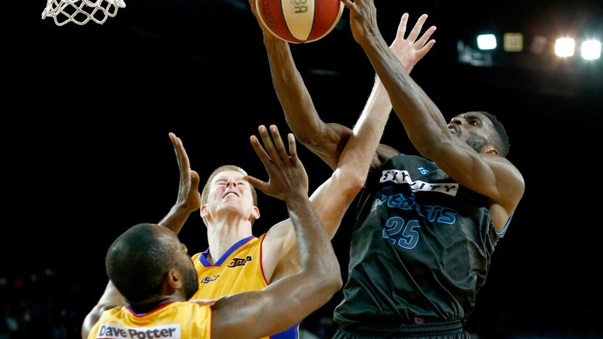 Ibekwe shoots for the basket against 36ers