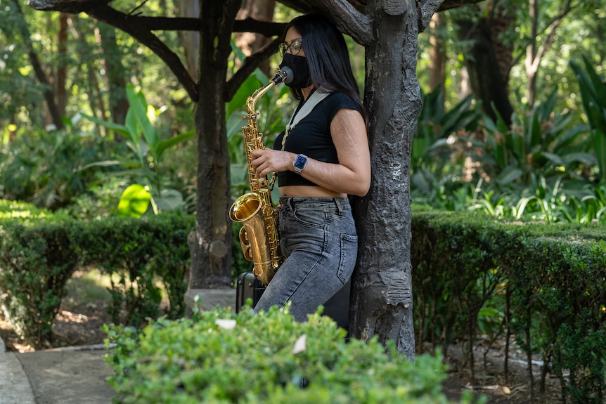 Maria Elena Rios playing saxophone