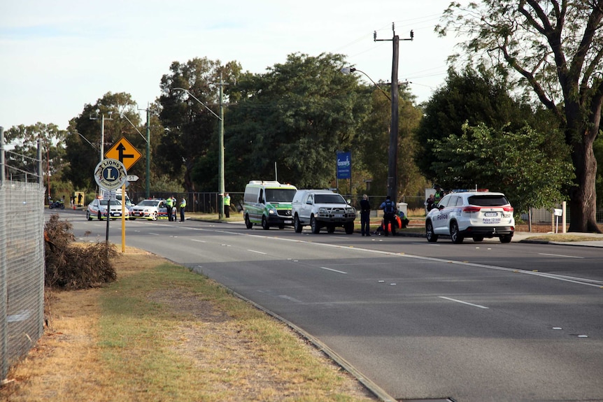Police on Albany Highway, along with an ambulance at the scene.