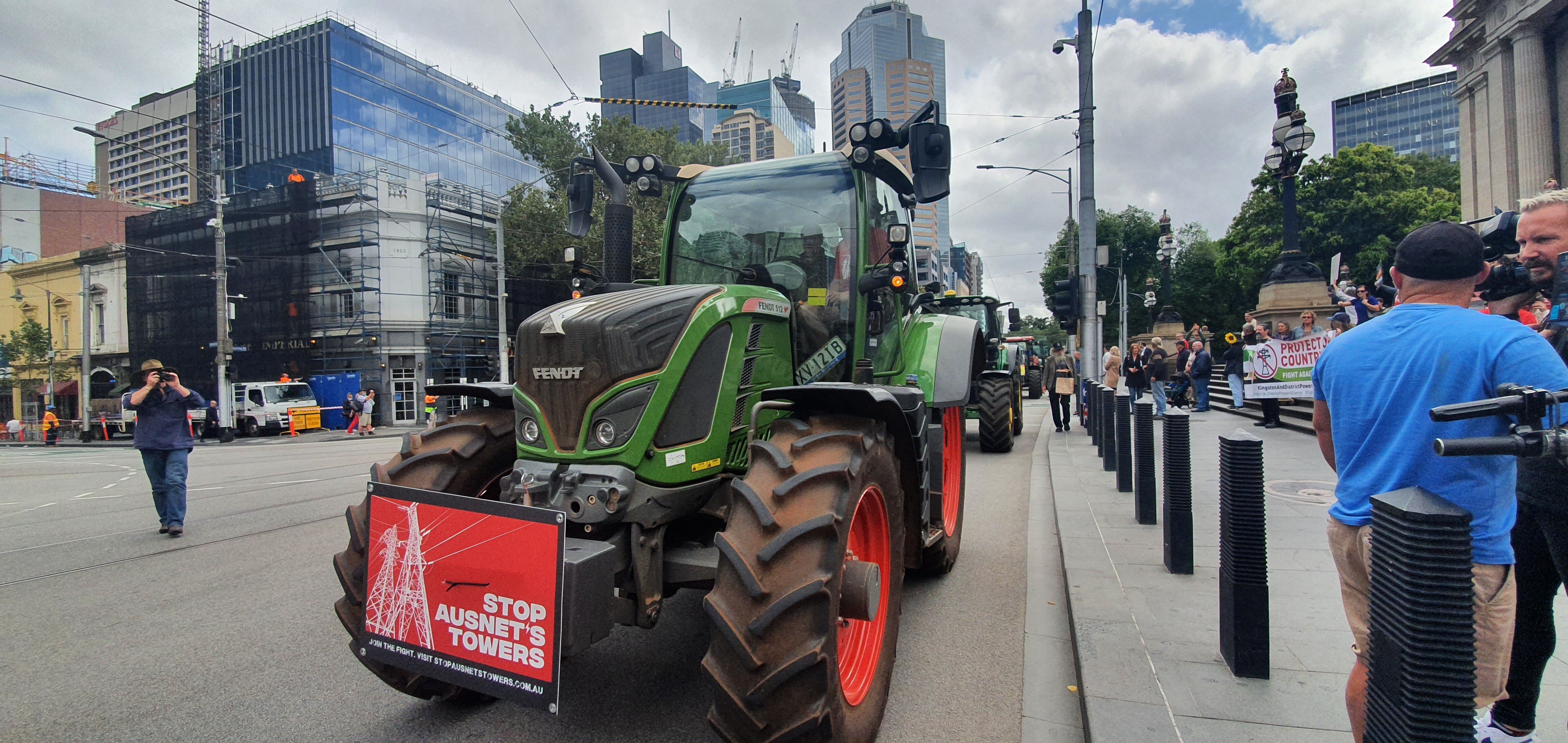 Tractors driving down Spring Street in Melbourne.