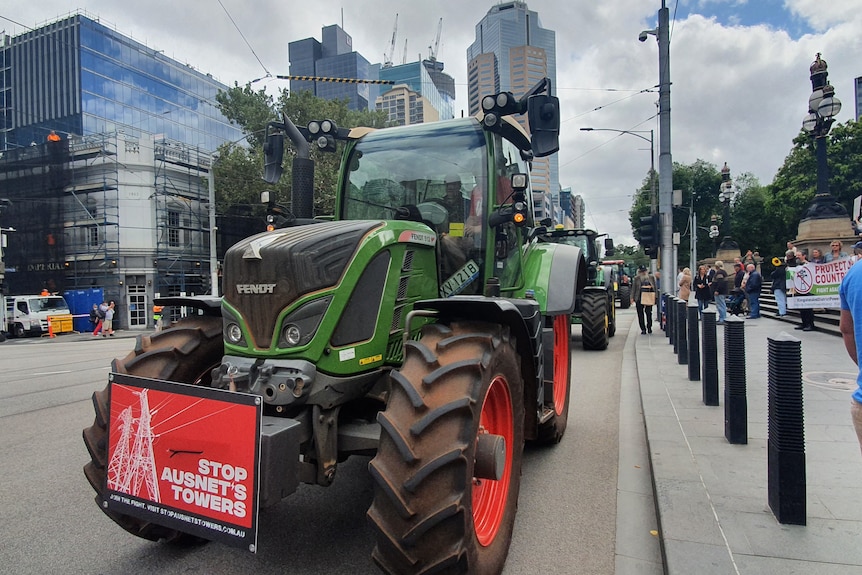 Tractors driving down Spring Street in Melbourne.