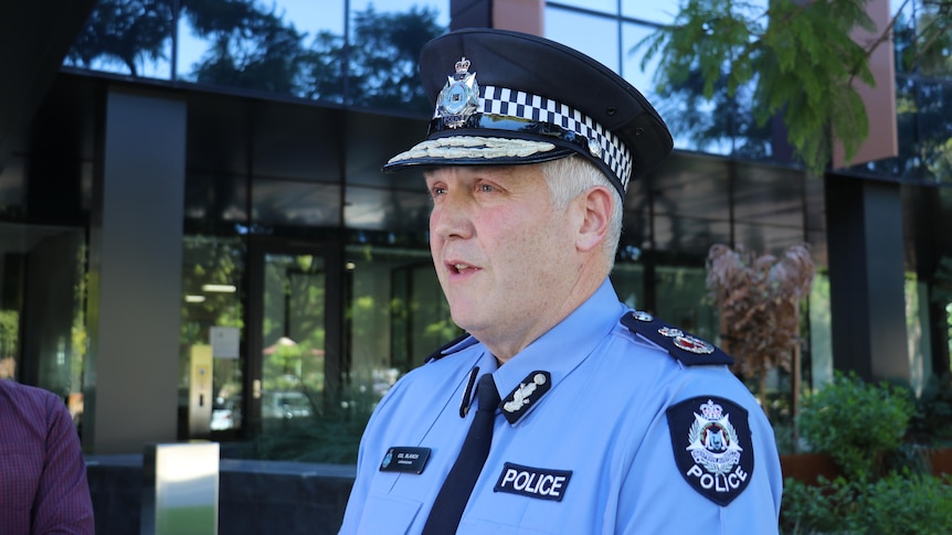 WA Police Commissioner Col Blanch stands in uniform outside a building.