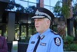 WA Police Commissioner Col Blanch stands in uniform outside a building.