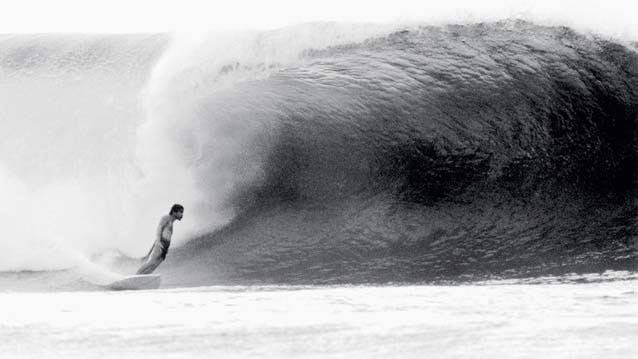 Gerry Lopez rides a wave