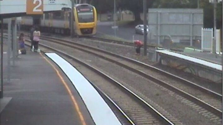 Train driver picking up the budgerigar