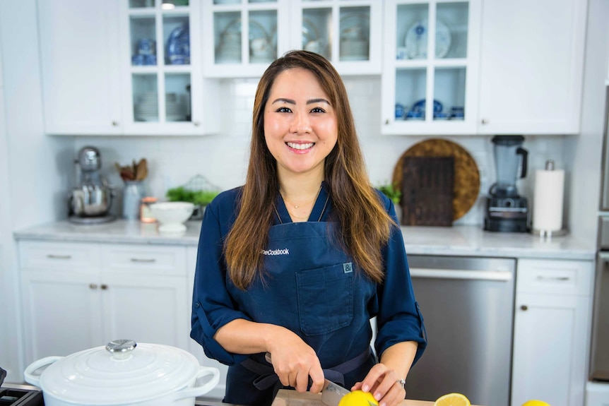Food blogger Namiko Chen cuts a lemon in her home kitchen and has tips for making dinner for one during isolation.