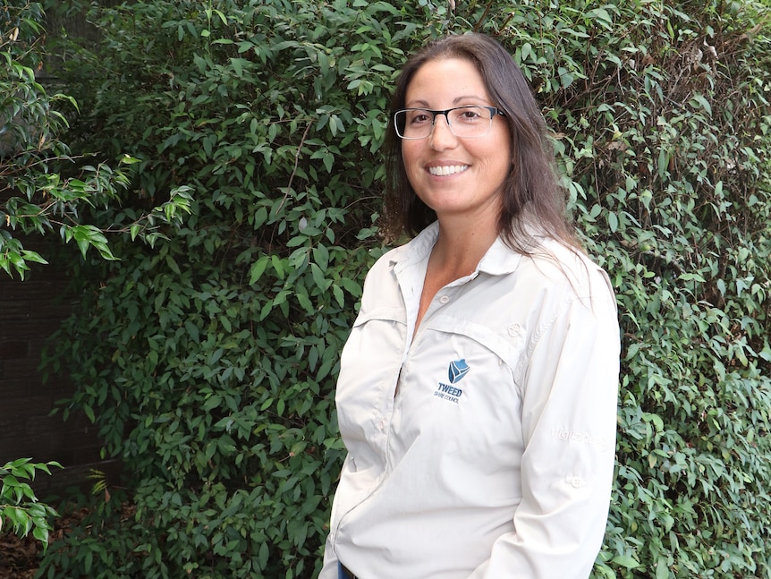 Rachel Hughes standing in front of trees.