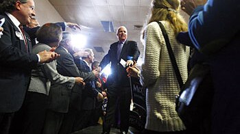 Republican presidential candidate US Senator John McCain greets supporters as he arrives for a campaign rally at the Colonial...