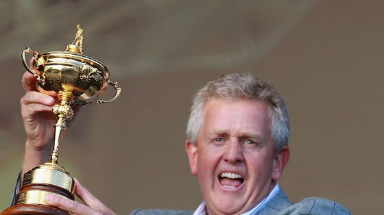 Winners are grinners... Colin Montgomerie poses with the Ryder Cup after his team's narrow victory