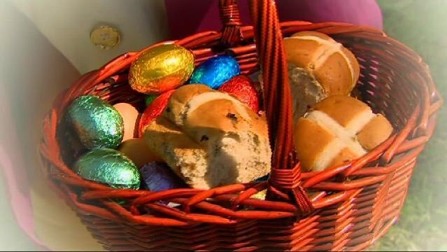 Easter eggs and hot cross buns in a basket