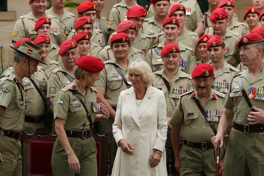 Camilla, Duchess of Cornwall speaks to Brigadier Cheryl Pearce after posing for a photograph with Military Police.