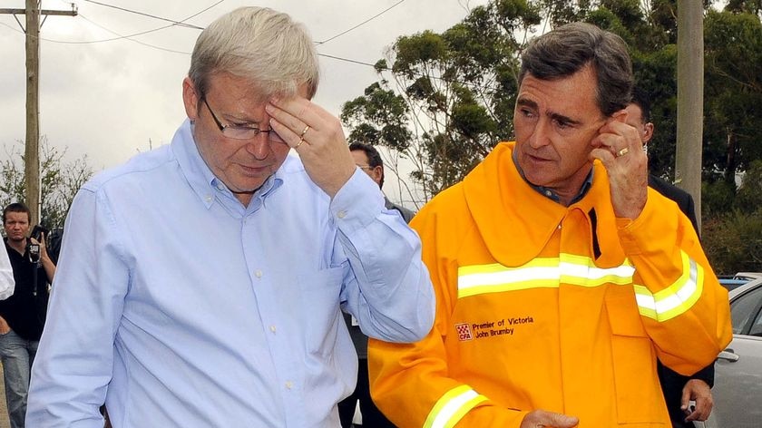 Mr Rudd, pictured with Victorian Premier John Brumby, will tour affected areas again today.