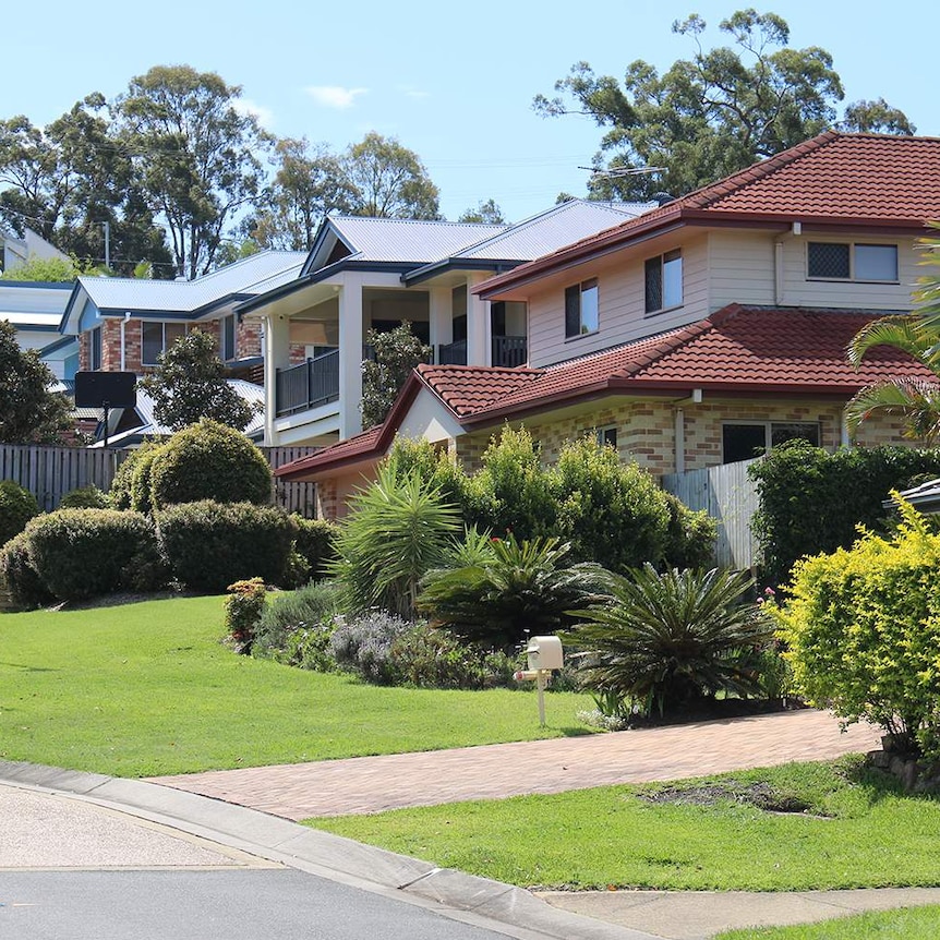 Modern houses along a street going up a hill in Brisbane on October 31, 2018.