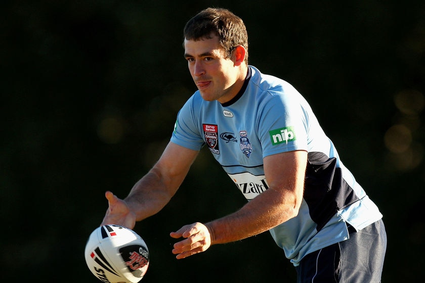 Campese offloads at Blues training