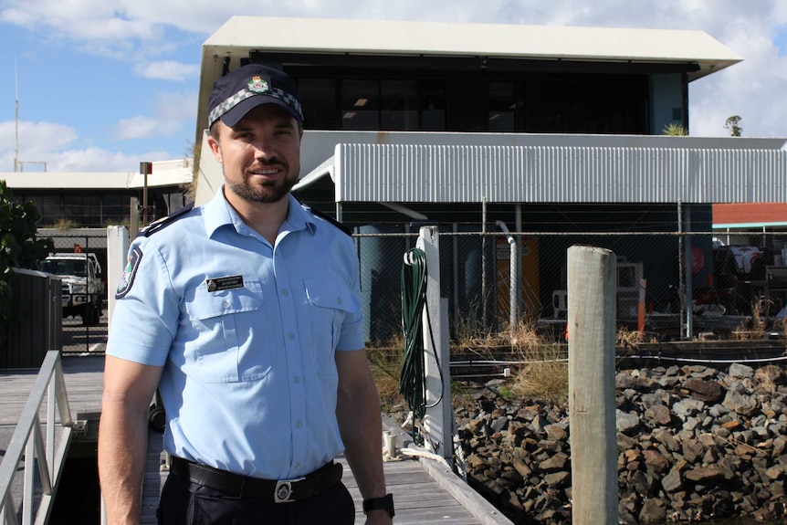 Senior Sergeant Jay Notaro in front of the water police building at the Southport Spit.
