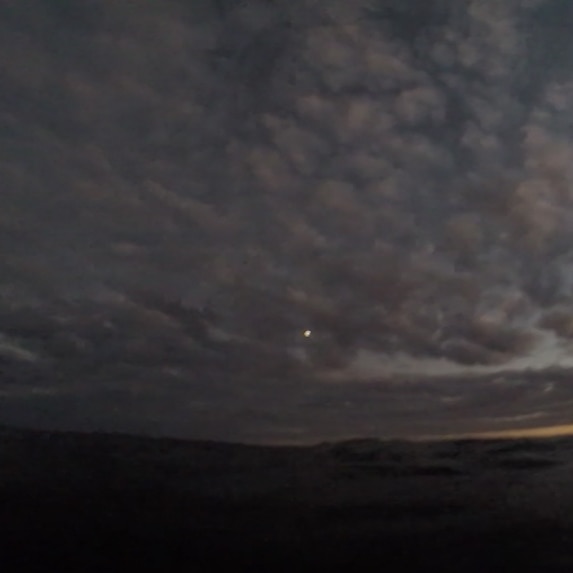 A frame from dive instructor Jacob Childs' GoPro vision shows a search aircraft looking for him.