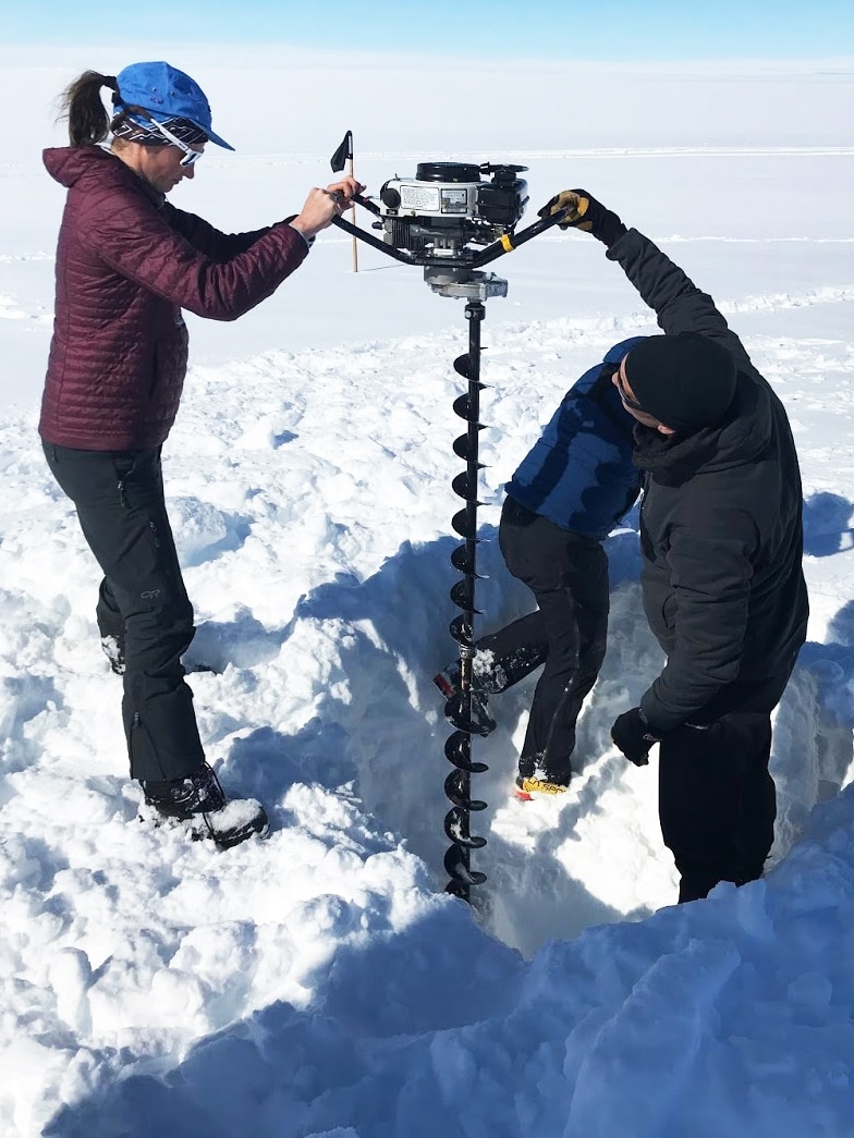Madi Gamble Rosevear and Ben Galton-Fenzi drilling at Totten Glacier, Antarctica.