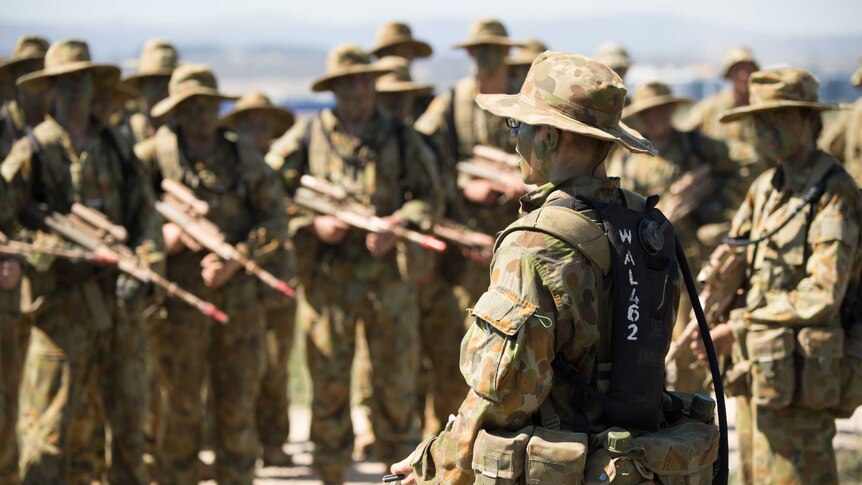 ADFA cadets listen to instructions during training.