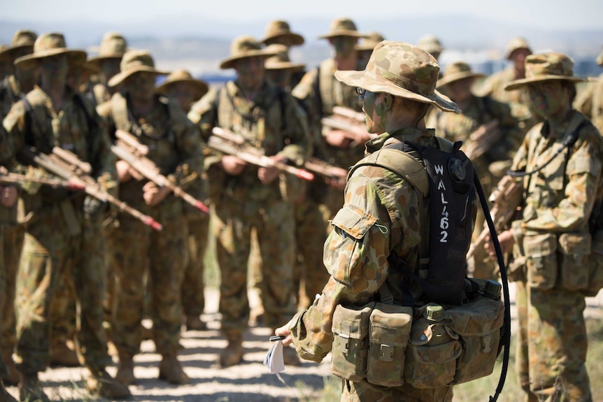 ADFA cadets listen to instructions during training.