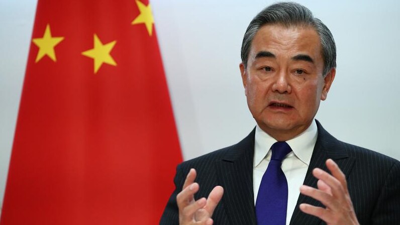 Chinese Foreign Minister Wang Yi gesturing.