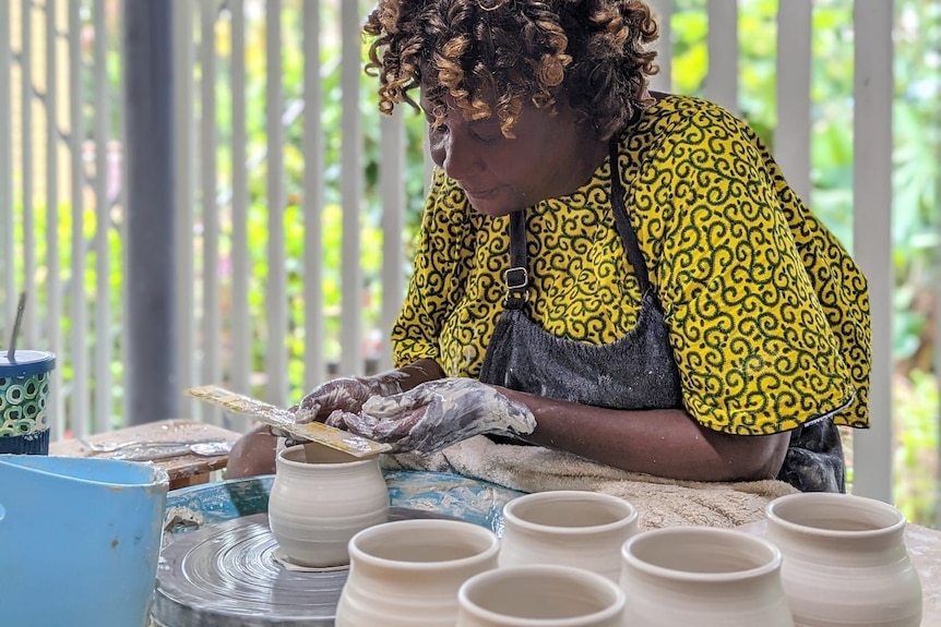 A woman doing pottery.