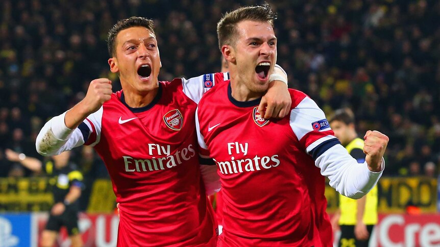 Ramsey and Ozil celebrate winner against Dortmund