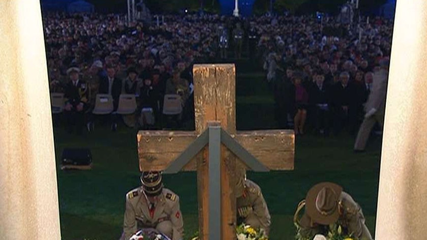 Military officers lay wreaths during the service.