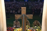 Military officers lay wreaths during the service.