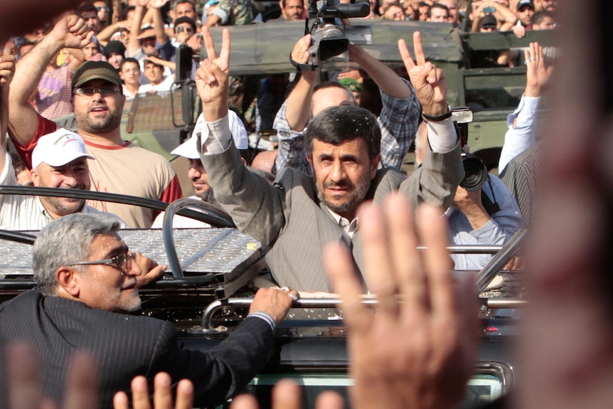 Mahmoud Ahmadinejad greets Hezbollah supporters (Reuters: Jamal Saidi)