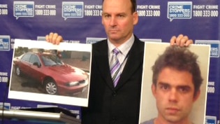 A photo of Michael Pruiti and his car held by detective senior sergeant James Bradley