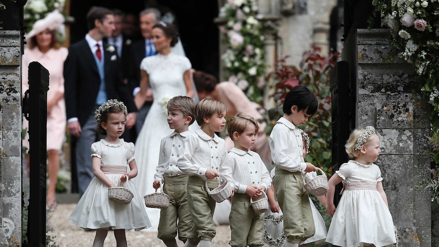 Prince George, fourth left, stands with the other flower boys and girls after the wedding.