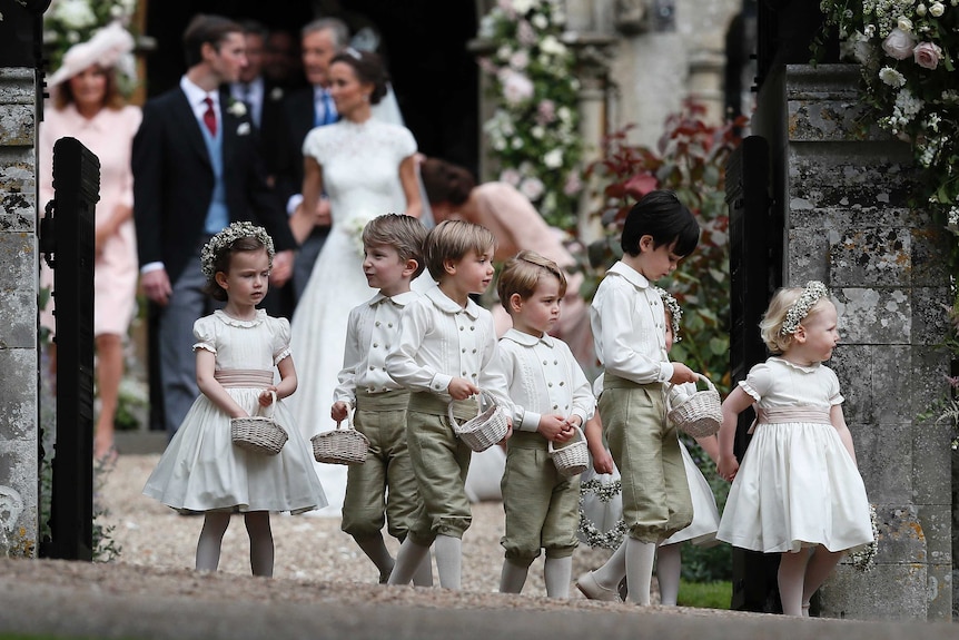 Prince George, fourth left, stands with the other flower boys and girls after the wedding.
