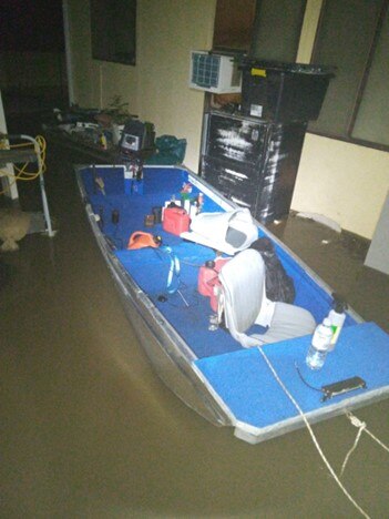 A boat in a flooded area.
