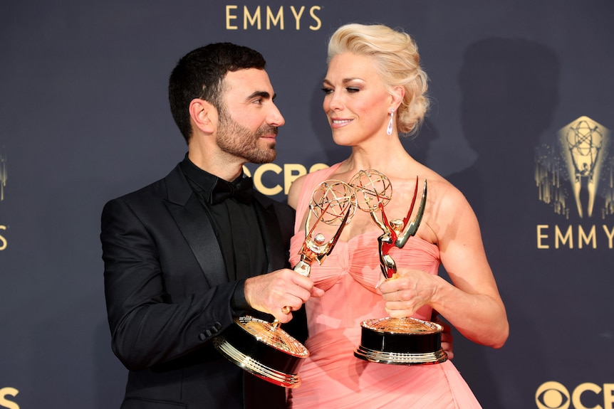 Brett Goldstein and Hannah Waddingham pose with their Emmy Award statues.