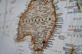 A map of the world zoomed on Australia with a pin in Sydney